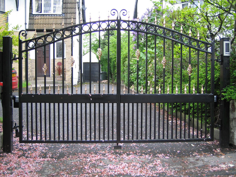 What are some advantages of wrought-iron metal gates?